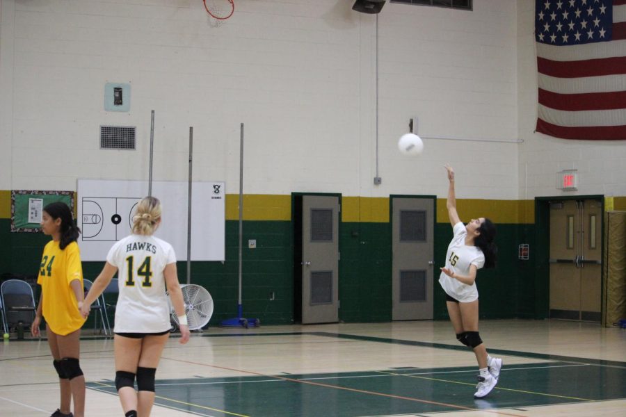 The freshman girls volleyball captain prepares to serve the ball.