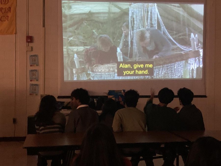 Students enjoy the movie Jumanji on the cafeteria projector.