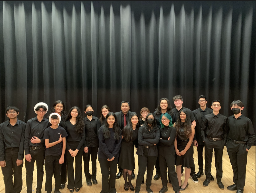 Guitar players together at their holiday concert.