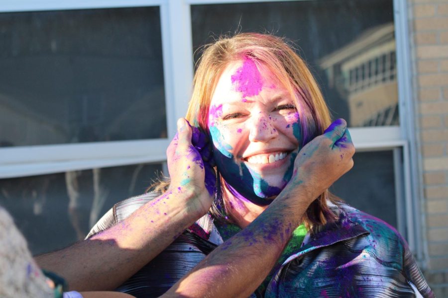 JP administrators, teachers, and students participate in a HSJPS event to celebrate the Hindu holiday of Holi.